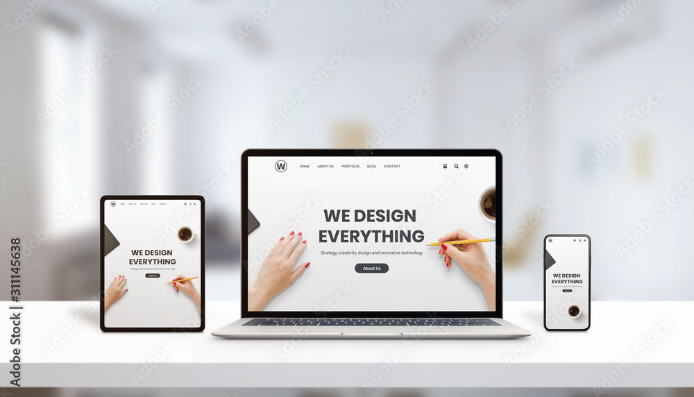 Responsive agency web page on laptop, tablet and phone display concept. Modern, flat web page design. Modern devices with thin edges. Office, studio desk
